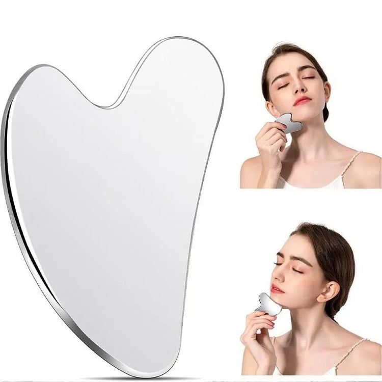 Woman using a heart-shaped gua sha on a white background